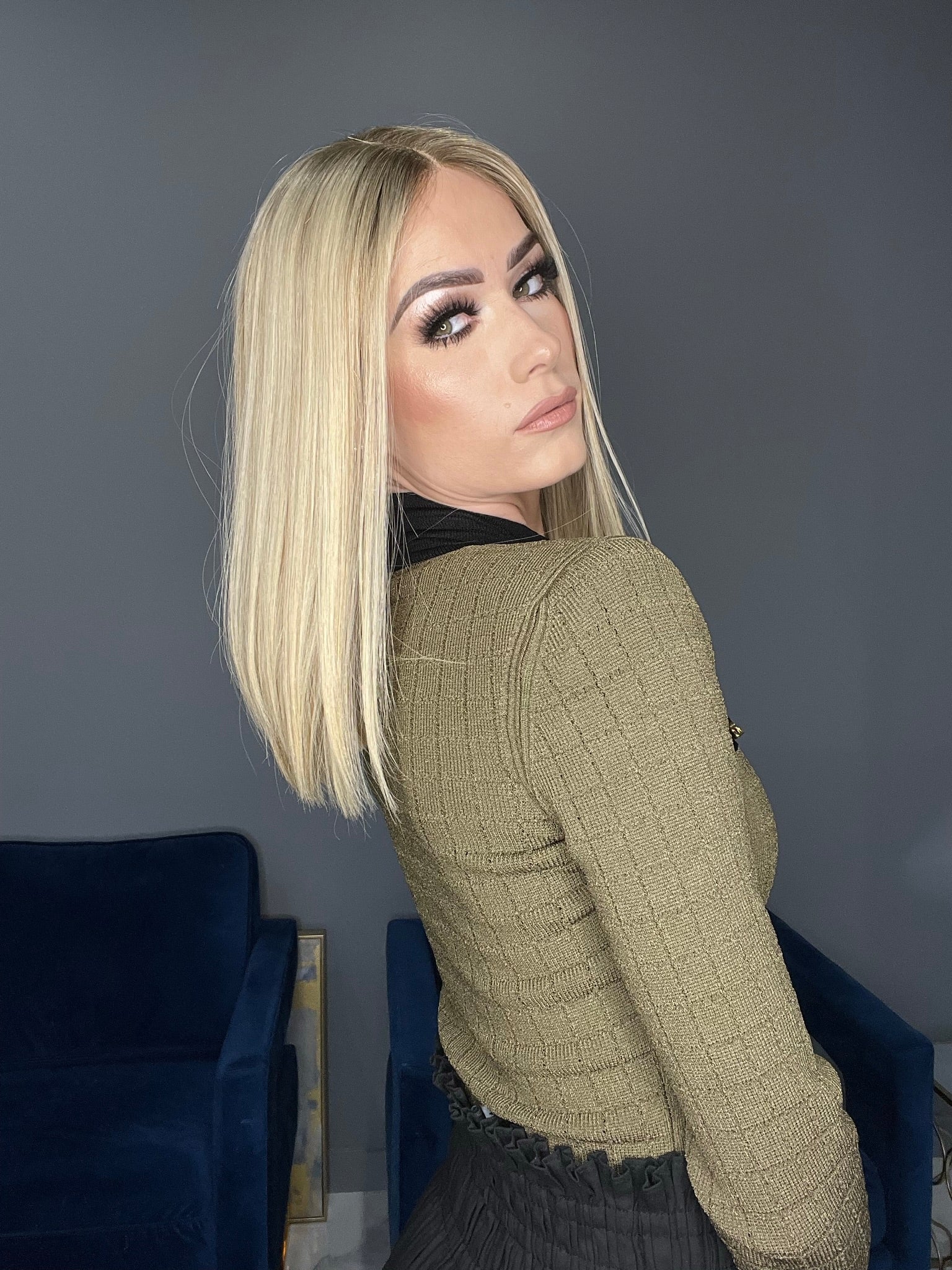 Blonde straight human hair wig with lace top, shoulder-length style for a natural look