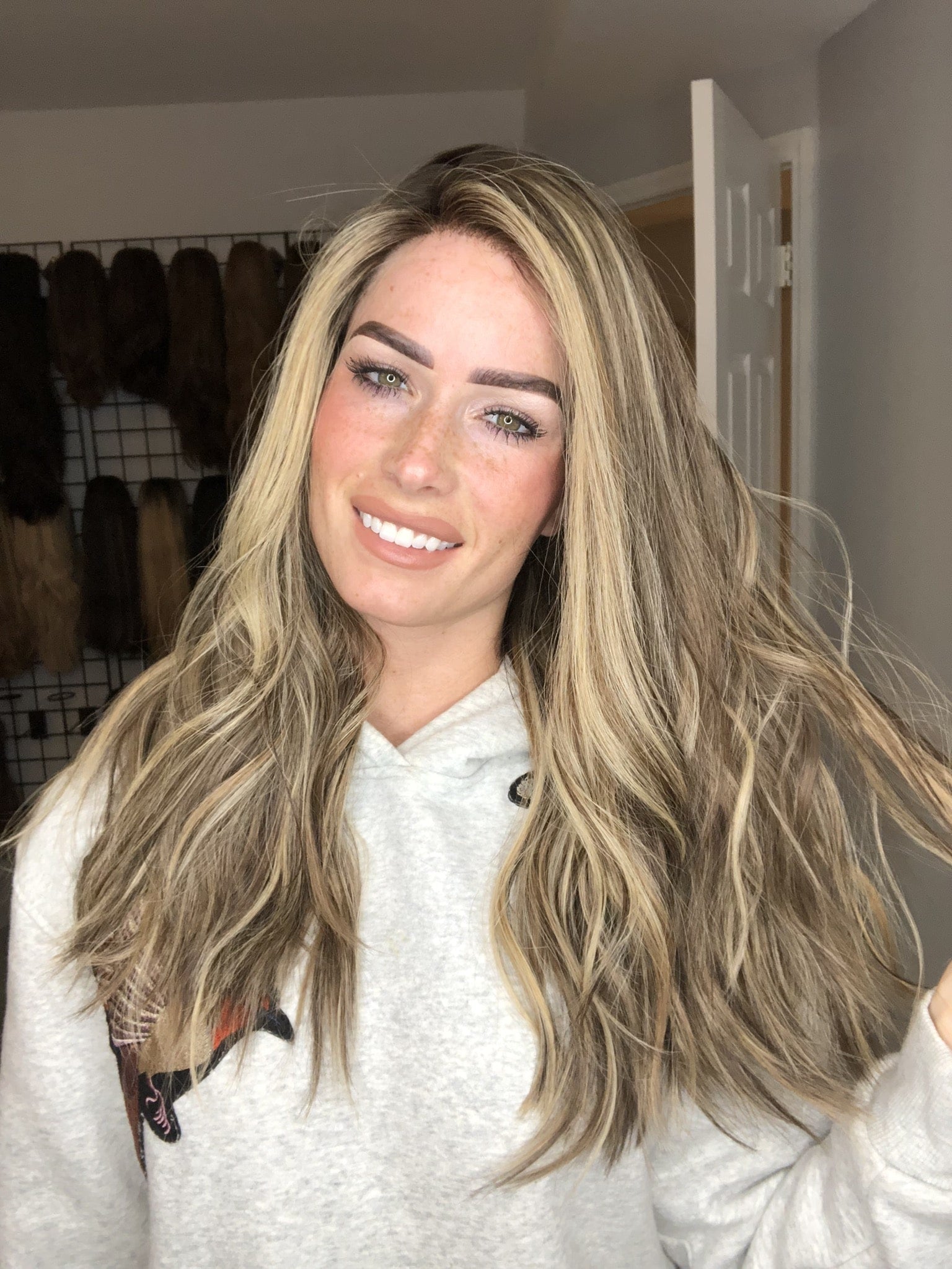 Long wavy human hair wig with balayage and money pieces, natural-looking lace top style