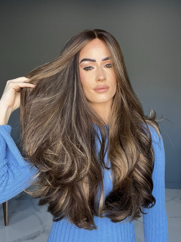 Long wavy human hair wig with balayage highlights and money pieces, natural-looking lace top
