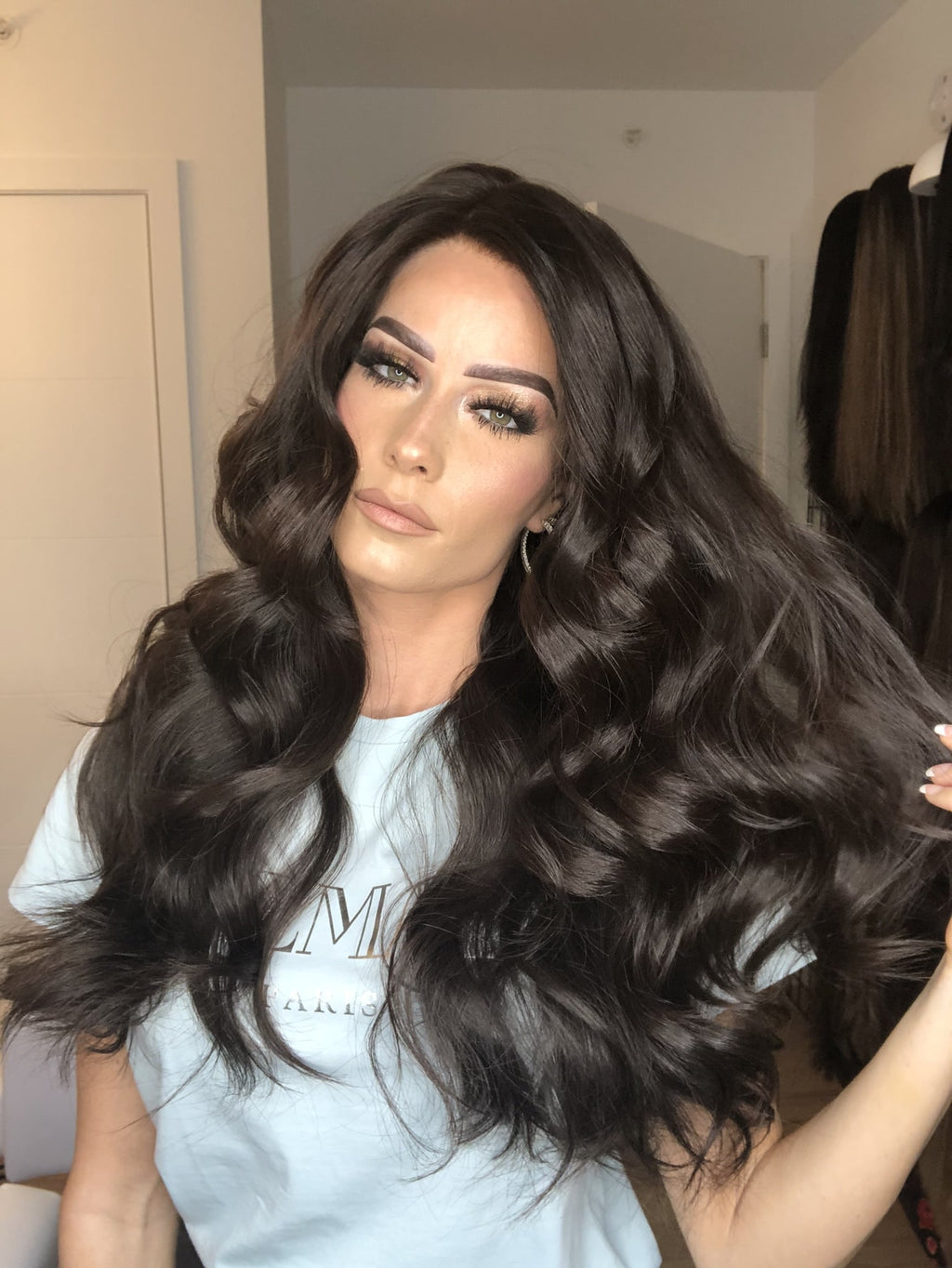 Long dark brown human hair wig with voluminous beach waves, lace top for natural look